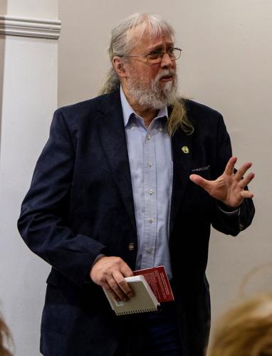 Dr-Jim-O'Sullivan-asks-a-question-at-'The-Catholic-Church-and-War-of-Independence'-lecture,-in-Killarney-Library.